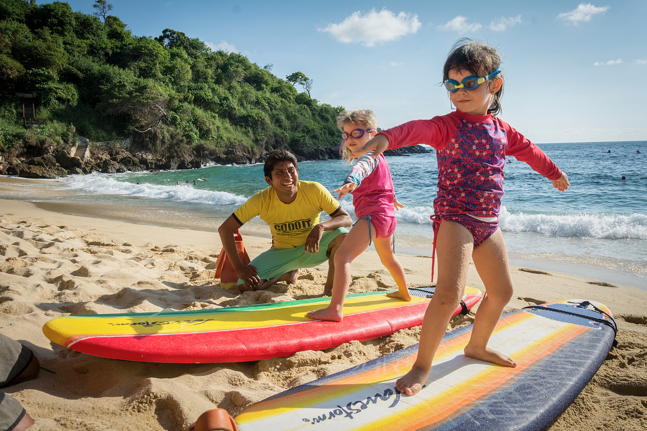 Godo and his assistant instructor, Obed, teach the 4-year-old Mellett twins in Carrizalillo beach.